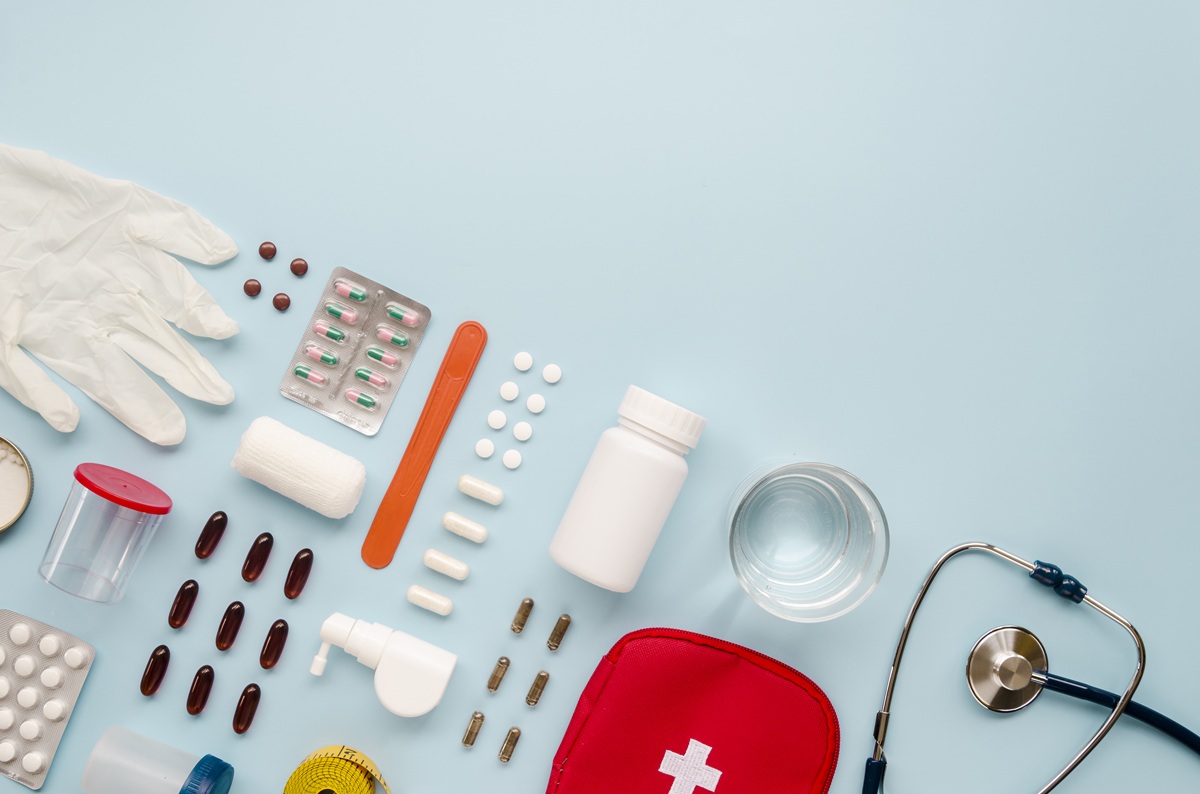 First aid supplies including gloves, bandages, medicines and a stethoscope.