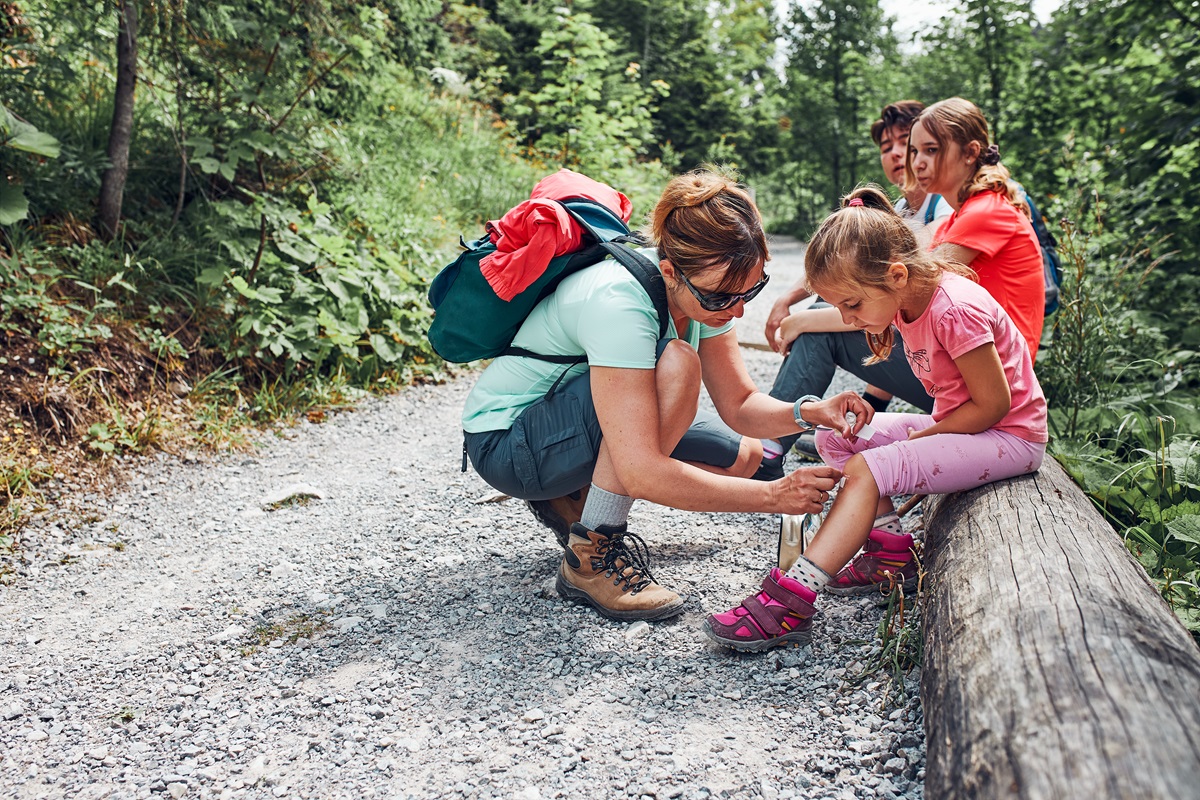 What must a family first aid kit contain